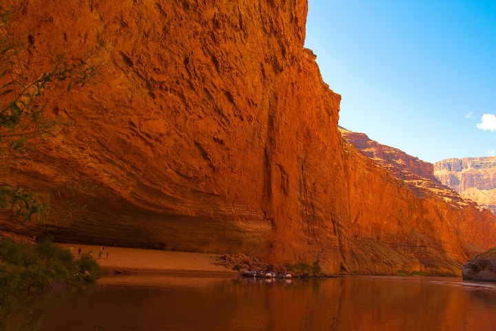 a body of water with a mountain in the background
