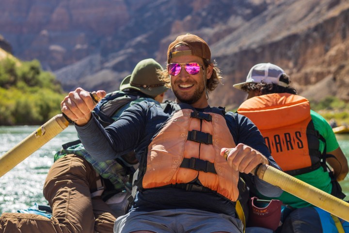 a person sitting on a raft in a body of water