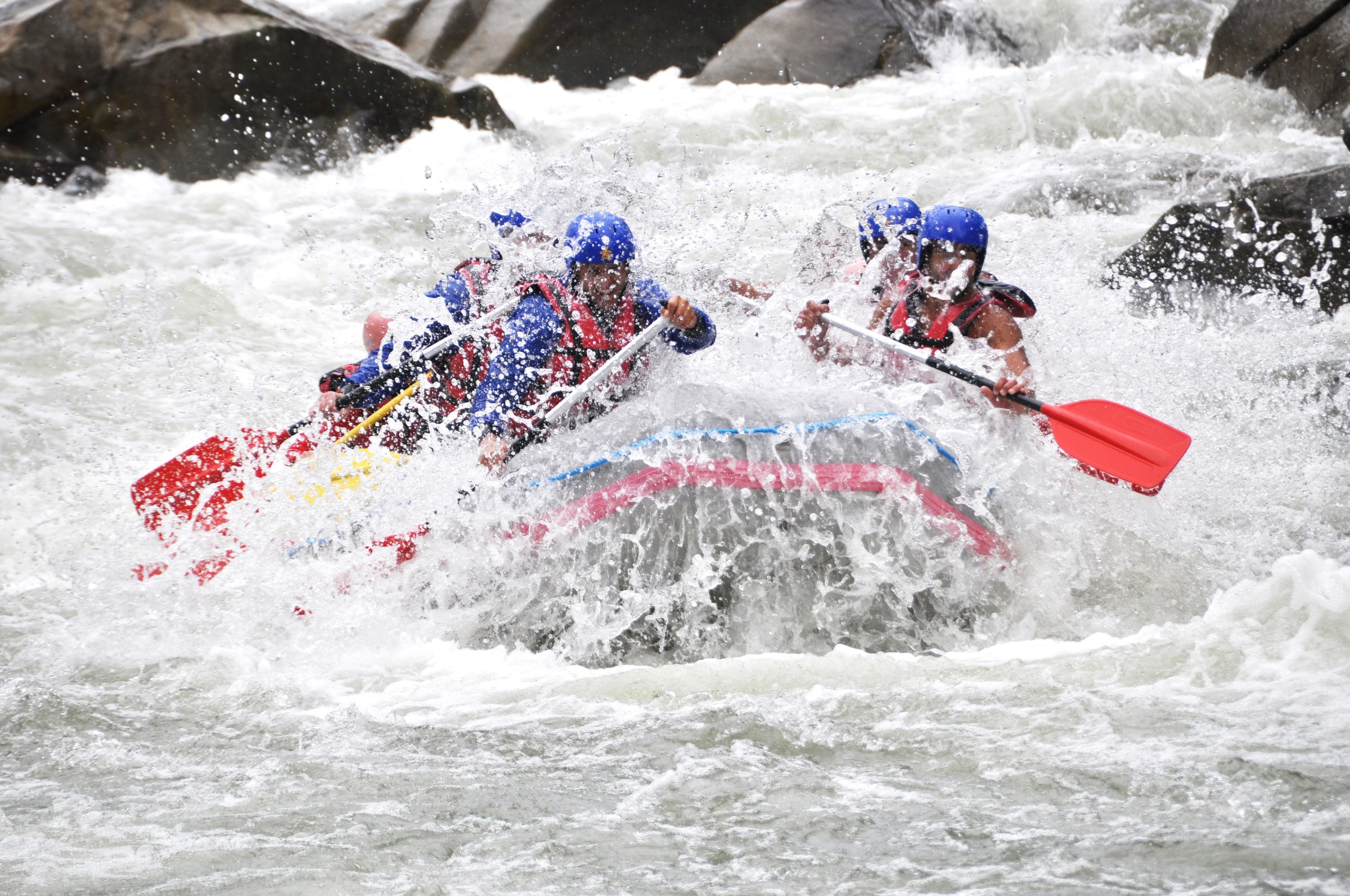 a group of people on a raft in the water