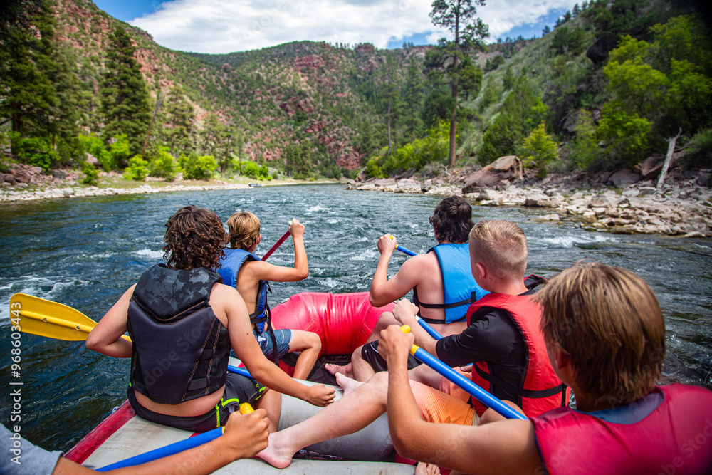 a group of people on a raft in a body of water